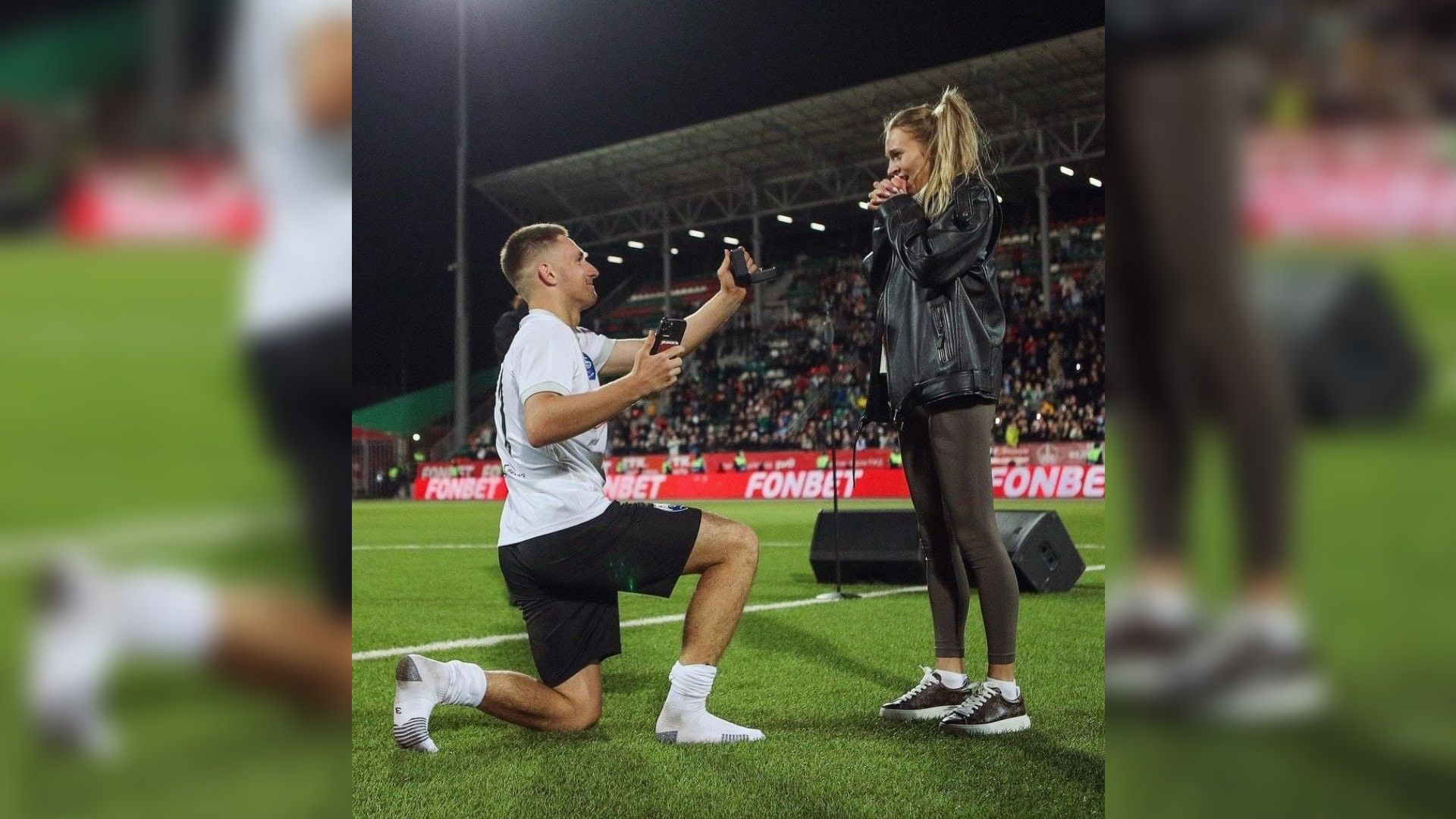Михаил Литвин делает предложение Юлии Бичан на футбольном стадионе